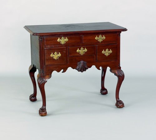 Philadelphia Chippendale style mahogany lowboy,: Philadelphia Chippendale style mahogany lowboy, the rectangular top with notched corners over a case with five short drawers and shell carved apron supported with shell carved cabriole legs terminatin