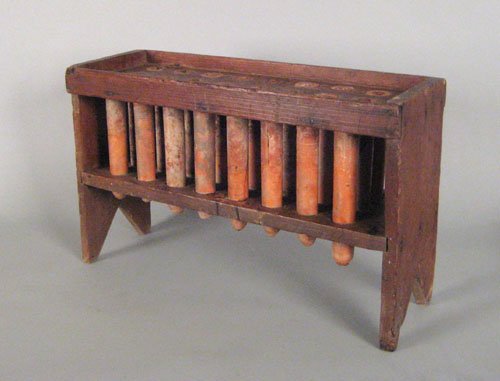 Pennsylvania pine candlemold, early 19th c., wi: Pennsylvania pine candlemold, early 19th c., with sixteen redware tubes, 14 3/4'' h., 24'' w., 8 1/4'' d.