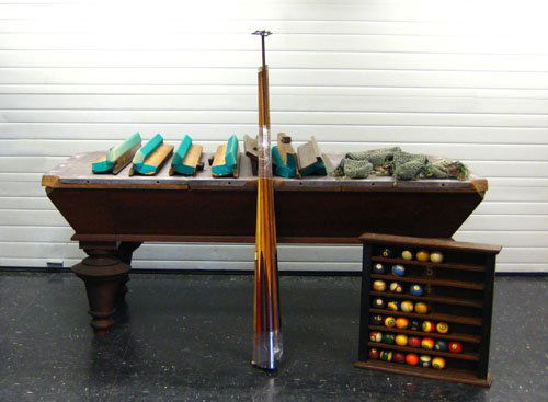 Brunswick-Balke-Collender oak pool table, ca. 18: Brunswick-Balke-Collender oak pool table, ca. 1885, 35 1/4'' h., 80'' w., 42'' d., together with early cues, ball rack, and balls.