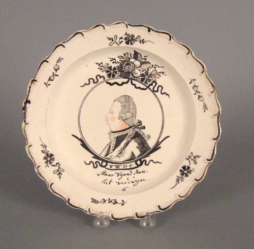 English creamware plate, late 18th c., decorate: English creamware plate, late 18th c., decorated for the Dutch market with a central portrait of Prince William of Orange, 9 1/2'' dia. Provenance: Collection of H. Richard Dietrich.