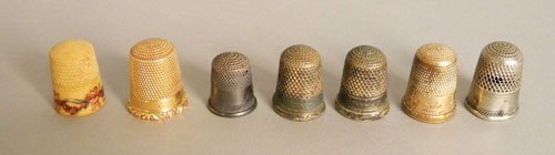 14K gold thimble, together with six other example: 14K gold thimble, together with six other examples.