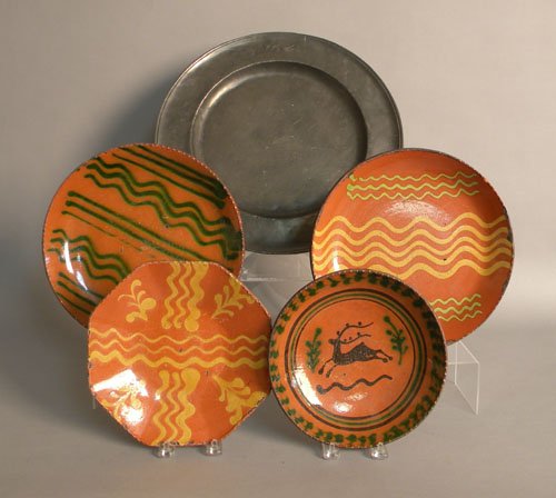 Four Shooner redware plates, together with a Warr