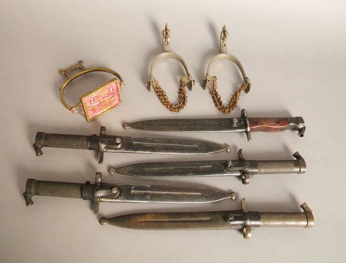 Five daggers, 20th c., together with a pair of sp