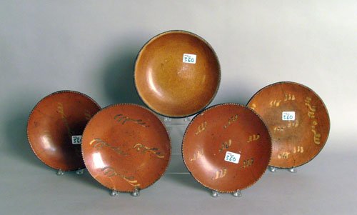 Five redware plates, four with yellow slip decora: Five redware plates, four with yellow slip decoration, 9 1/4'' dia. - 10'' dia. (losses)