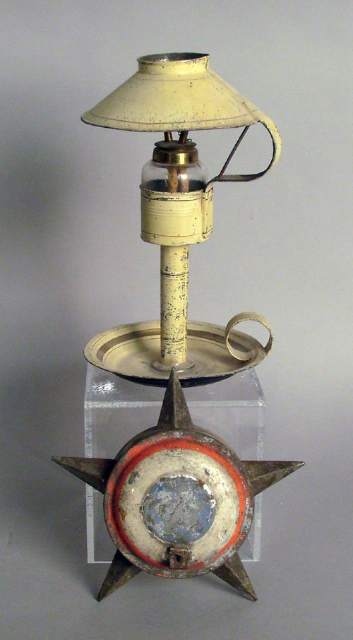 Tole whale oil lamp, 19th c., 11 3/4'' h., togethe: Tole whale oil lamp, 19th c., 11 3/4'' h., together with a tin star ornament, 8'' dia.