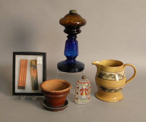 Group of miscellaneous objects to include a mocha: Group of miscellaneous objects to include a mocha pitcher, 7 1/4'' h., Stiegel type bottle, 5 1/4'' h., redware flower pot, 4 1/2'' h., Civil War era slate pencils, and a blown amber, and glue glass o