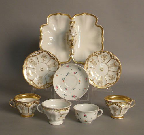 Pair of KPM cups and saucers with gilt decoration: Pair of KPM cups and saucers with gilt decoration, together with a KPM condiment dish, 11 1/2'' l., single cup, and a cup and saucer.