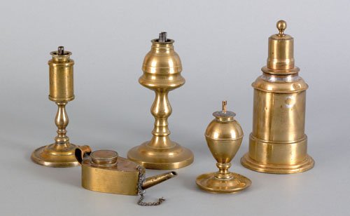 Three brass oil lamps, 19th c., tallest - 6 1/2: Three brass oil lamps, 19th c., tallest - 6 1/2'' h., together with a torch lamp and fluid lamp.