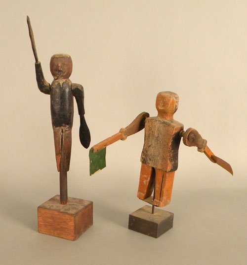 Two carved and painted whirligigs, 16'' h., 13'' h: Two carved and painted whirligigs, 16'' h., 13'' h.