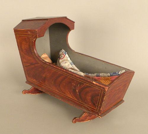 Painted doll cradle, 19th c., 14'' h., 19'' w.: Painted doll cradle, 19th c., 14'' h., 19'' w.