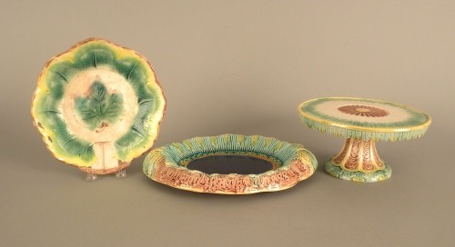 Majolica cake stand, 5'' h., 10'' dia., together w: Majolica cake stand, 5'' h., 10'' dia., together with two serving dishes, 10'' dia. and 11'' x 13''.