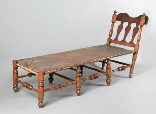 Pennsylvania William & Mary maple daybed, ca. 17: Pennsylvania William & Mary maple daybed, ca. 1740, the yoke crest over three vasiform splats and the original leather upholstered frame supported by boldly turned legs and stretchers, 37'' h., 71'' w