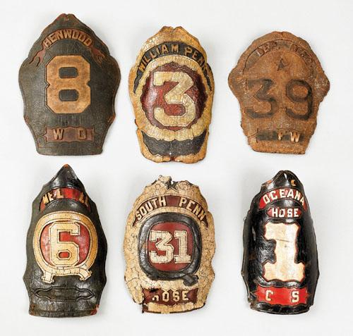 Six American painted leather fire shields, 19th: Six American painted leather fire shields, 19th c., inscribed William Penn 3, Oceana Hose 1, Henwood 8, South Penn Hose 31, Dependence 39, and another shield.