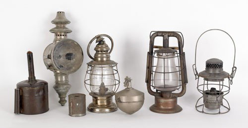Group of lighting to include Dietz Fire Departm: Group of lighting to include Dietz Fire Department tubular lantern, Arm Spear lantern, another lantern labeled Essex Fire Company, an engine lantern, and three tin torches.