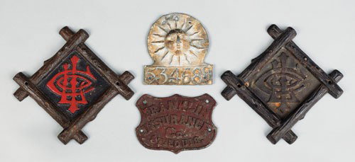 Two cast iron Lumberman's Insurance Company fire: Two cast iron Lumberman's Insurance Company fire marks, ca. 1873, 9 1/4'' h., 9 1/4'' w., together with a Zinc Franklin Insurance Company of St. Louis fire mark, ca. 1885, 5 3/4'' h., 7 1/2'' w. and a