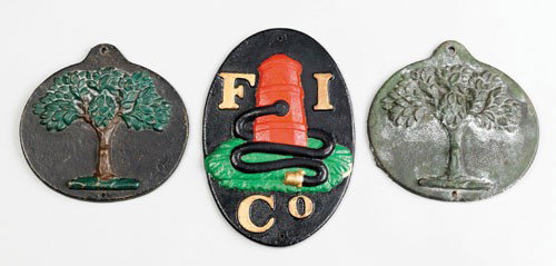 Two cast iron fire marks for the Mutual Assuranc: Two cast iron fire marks for the Mutual Assurance Company of Philadelphia, issued 1827, one possibly a later copy, 8 1/4'' x 8 1/2'', together with a Firemen's Insurance Company mark, 11 1/4'' h., 7 1