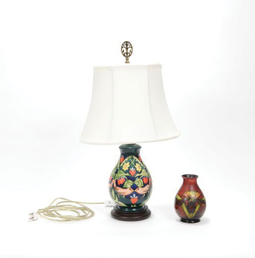 Moorcroft pottery table lamp, 20th c., 21'' h., to: Moorcroft pottery table lamp, 20th c., 21'' h., together with a vase, 5 1/4'' h.