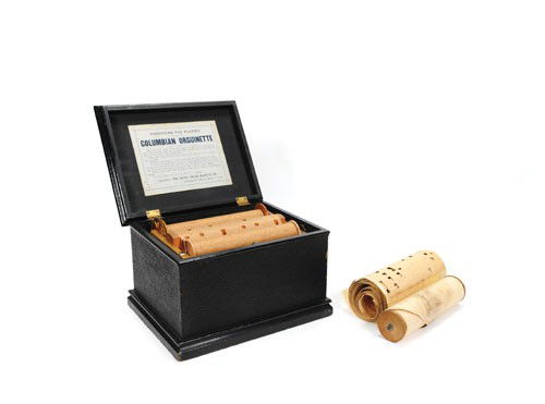 Bates Organ Manufacturing Company Columbian Orgui: Bates Organ Manufacturing Company Columbian Orguinette roller organ, late 19th c., with three rolls, 7 1/2'' h., 11 1/2'' w.