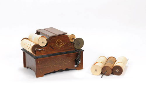 Euphonia roller organ, late 19th c., 7 1/2'' h., t: Euphonia roller organ, late 19th c., 7 1/2'' h., together with five rolls.