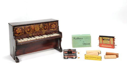 Schoenhut toy piano, early 20th c., 10 3/4'' h., 1: Schoenhut toy piano, early 20th c., 10 3/4'' h., 15 3/4'' w., together with Rolmonicat & Plarola organ with original box.