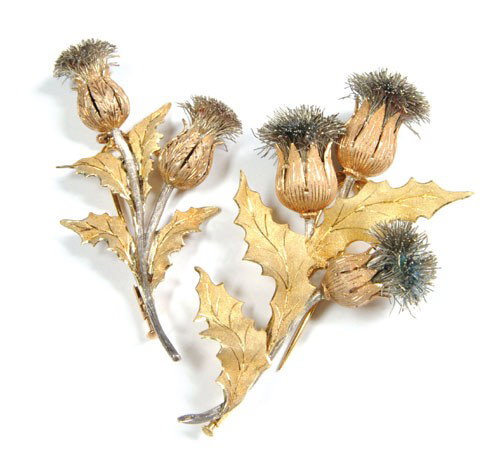 Two 18K yellow and rose gold by Buccellati fur c: Two 18K yellow and rose gold by Buccellati fur clips in thistle motif with silver wire thistle and stems, 77 mm and 61 mm long, signed in original box, 18.5 dwt. and 9.9 dwt.