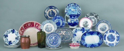 Collection of ceramics to include flow blue, blue: Collection of ceramics to include flow blue, blue willow, etc., together with a copper pitcher and an olive glass bottle.