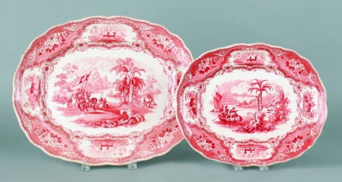 Two red Staffordshire Columbus pattern platters, : Two red Staffordshire Columbus pattern platters, 19th c., 10 3/4'' x 13 1/4'' and 13 3/4'' x 17''.