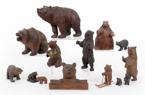 Eleven carved bears, 20th c., together with a red: Eleven carved bears, 20th c., together with a redware example, largest - 8 1/2'' h.