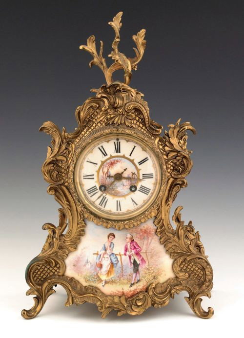 French ormolu and porcelain mantle clock retailed: French ormolu and porcelain mantle clock retailed by J.E. Caldwell & Co., 15 1/2'' h.
