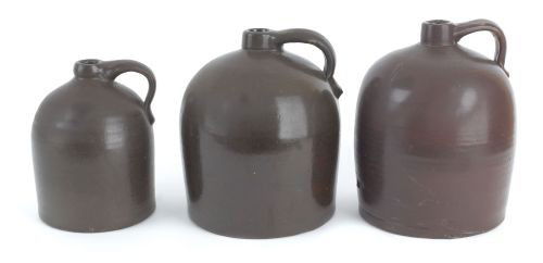Three redware jugs, 19th c., 9 1/4'' h., 11'' h.,: Three redware jugs, 19th c., 9 1/4'' h., 11'' h., and 11 1/2'' h.
