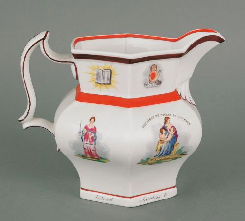 Ironstone pitcher, 19th c. decorated with frate: Ironstone pitcher, 19th c. decorated with fraternal symbols, 7 1/4'' h.