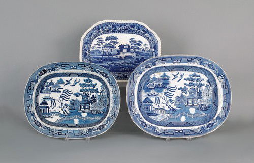 Two blue willow platters, 19th c., 16 1/2'' l., 21: Two blue willow platters, 19th c., 16 1/2'' l., 21'' w. and 15'' l., 19'' w., together with an English scenery platter, 13 1/2'' l., 17 1/4'' w.