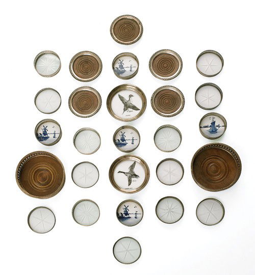 Collection of sterling and plated coasters, sever: Collection of sterling and plated coasters, several with porcelain inserts.