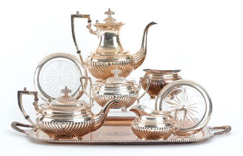 Silver plate tea service, together with a pair of: Silver plate tea service, together with a pair of sterling mounted wine coasters.