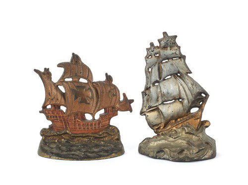 Two cast iron ship doorstops, 7 1/2'' h. and 9'' : Two cast iron ship doorstops, 7 1/2'' h. and 9'' h.