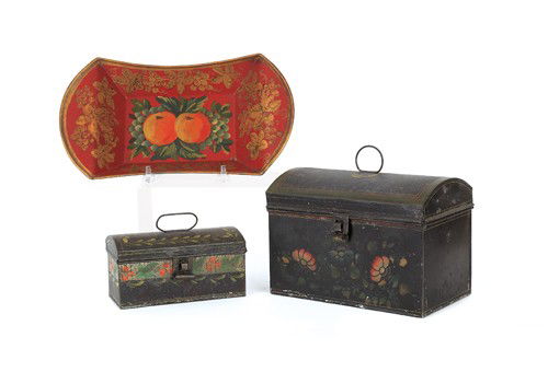 Two tole dome lid boxes, 19th c., largest - 6 3/4: Two tole dome lid boxes, 19th c., largest - 6 3/4'' h., 9 1/2'' l., together with a red bread tray.