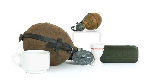 Miscellaneous German WWII items, to include Krieg: Miscellaneous German WWII items, to include Kriegsmarine coffee cup and egg cup, German beer stein, dog tag, ineit grenade, and a canteen.