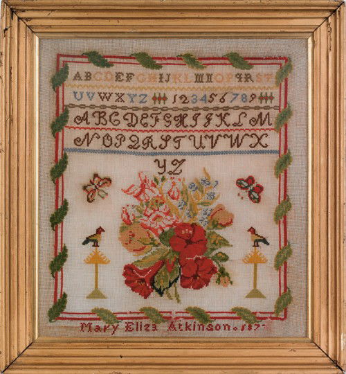 Wool on linen sampler with a central bouquet, wro: Wool on linen sampler with a central bouquet, wrought by Mary Atkinson, 18 1/2'' x 16 1/2''.