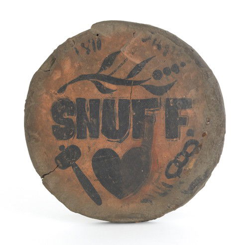 Redware trivet, 19th c., stenciled SNUFF, above: Redware trivet, 19th c., stenciled SNUFF, above a hammer, heart, and chain link, 8 1/4'' dia.