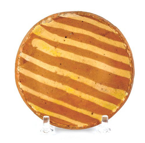 Miniature redware plate, 19th c., with yellow s: Miniature redware plate, 19th c., with yellow slip line decoration, 4'' dia. Provenance: Christies, Collection of Paul Flack, September 6, 1997.