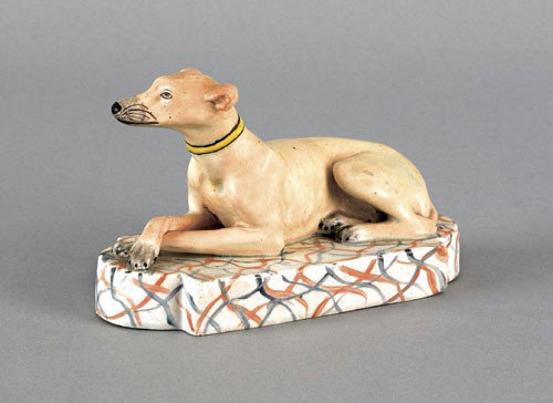 English Staffordshire pearlware figure of a recl: English Staffordshire pearlware figure of a reclining hound, early 19th c., 3 1/2'' h., 6'' w.