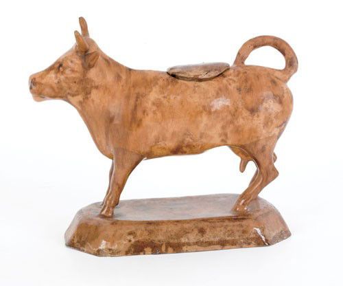 Earthenware cow creamer and cover, ca. 1850, at: Earthenware cow creamer and cover, ca. 1850, attributed to the workshop of Haig Pottery of Philadelphia, 7 1/2'' h., 8'' w. Provenance: Titus Geesey; Bergman, York, Pennsylvania.