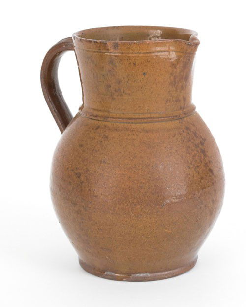 Pennsylvania redware pitcher, 19th c., 8 3/4'' h: Pennsylvania redware pitcher, 19th c., 8 3/4'' h.