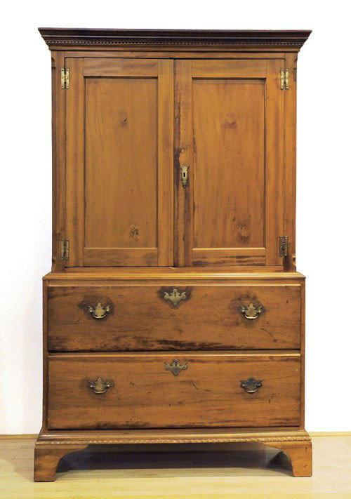 Pennsylvania Chippendale cherry linen press, ca.: Pennsylvania Chippendale cherry linen press, ca. 1800, in two parts, the top section with dentil molding over two recessed panel doors, the lower section with two full width drawers, all resting on br