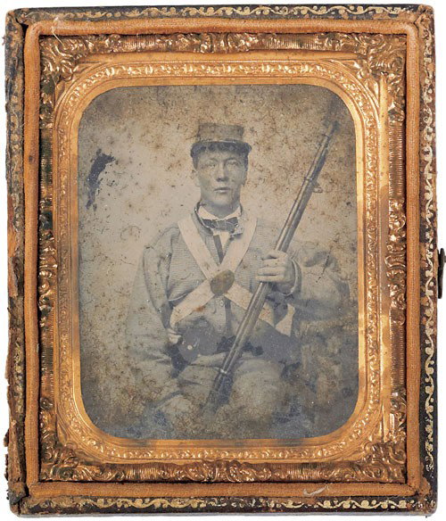 Unidentified Confederate soldier ambrotype, in: Unidentified Confederate soldier ambrotype, in uniform holding an Enfield musket, 3 1/4'' x 2 3/4''.
