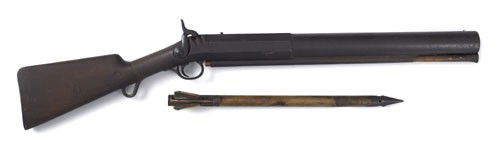 C.C. Brand percussion whaling gun, 7/8'' bore, h: C.C. Brand percussion whaling gun, 7/8'' bore, having a walnut stock with iron butt plate, including one brass bomb lance, 20'' octagonal to round barrel.