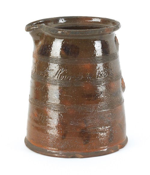 Pennsylvania redware pitcher, inscribed Mrs. B: Pennsylvania redware pitcher, inscribed Mrs. Benjamin Burt Nov., 4th, 1852, Presented by Wm. Diamond For Buckwheat Batter, 9'' h.