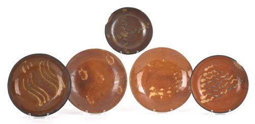 Five Pennsylvania slip decorated redware plates,: Five Pennsylvania slip decorated redware plates, 19th c., largest - 8 1/4'' h.
