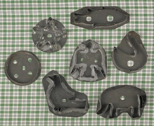 Six large tin cookie cutters, to include an ele: Six large tin cookie cutters, to include an elephant, eagle, star, circle, fish, bird, and a duck.