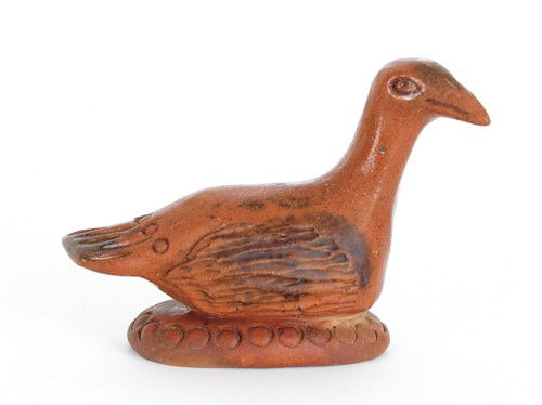 Pennsylvania redware bird rattle, 19th c., with: Pennsylvania redware bird rattle, 19th c., with incised wings and manganese decoration, 2 5/8'' h.